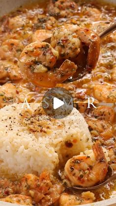 shrimp and rice in a skillet being stirred with a wooden spoon