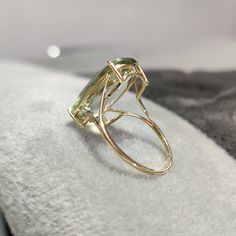 You can choose your own gem in my store. Let me know if you would like to see options Details of the ring Gem: Green Amethyst Gem size & shape: 20x12 mm and Cushion Center Gem weight: 9.70 carat Gold purity: 14K (58.33% approx.) Gold weight: 1.48 grams total weight of ring: 3.42 grams Fine briolette cut Green Amethyst cushion shape gemstone ring set in solid 14K yellow gold. The Gold purity is guaranteed and it comes with authentic 14 kt gold hallmark. Since these Rings are handmade, Size Cu Green Amethyst Jewelry, Chrysoprase Necklace, Green Amethyst Ring, Gold Gemstone Ring, Solid Gold Earrings, Amethyst Gem, Blue Moonstone, Alternative Engagement Rings, Amethyst Jewelry