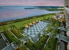 an aerial view of a hotel overlooking a lake