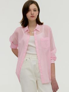 This product is a glow sheer shirt that exudes a light and airy feel, perfect for layering over casual or dressy outfits. It features a delicate, translucent fabric that adds a touch of elegance and softness to the overall look. The relaxed fit and adjustable drawstring at the waist provide both comfort and a customizable silhouette. - This shirt is crafted with a lightweight sheer fabric, offering a breezy, ethereal quality ideal for spring and summer days.- Designed with a button-down front and classic collar, it combines traditional shirt elements with a modern, sheer twist.- The adjustable drawstring waist allows the wearer to tailor the fit to their liking, enhancing the shirt's versatility.- Its long sleeves can be rolled up for a more relaxed look or left down for a more formal Spring Sheer Blouse For Layering, Sheer Blouse For Spring Layering, Feminine Pink Shirt For Summer, Feminine Pink Summer Shirt, Pink Sheer Sleeves Blouse For Spring, Pink Blouse With Sheer Sleeves For Spring, Chic Pink Blouse With Sheer Sleeves, Pink Relaxed Fit Feminine Shirt, Casual Long Sleeve Sheer Shirt