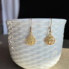 "Filigree Earrings,Flower Earrings, Gold Filigree Earrings, Lace Earrings, Boho Earrings, Hippie Earrings,Dangle Earrings,Gift for Her A departure from our traditional \"Daniela\" style, these triple filigree golden bead drop earrings are for when a little extra glitz is needed.  When you wear these, the shimmering filigree cast a luminous glow on all of your special occasions. These are our favorite go to earrings when a little extra flourish is needed.  Materials: 14K Gold Plated Brass Teardro Filigree Drop Earrings As A Gift, Gift Filigree Drop Earrings, Gift Drop Earrings With Filigree Detail, Bohemian Gold Hypoallergenic Teardrop Earrings, Bohemian Hypoallergenic Drop Earrings, Teardrop Flower Pierced Earrings Gift, Teardrop Flower Earrings Gift, Gold Delicate Hypoallergenic Teardrop Earrings, Delicate Teardrop Flower Earrings For Pierced Ears