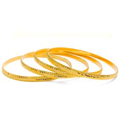 These Engraved High Finish Bangles are a must-have in any jewelry collection. Crafted from 22k yellow gold, this set of four bangles has a combined weight of 52.1 grams. The intricate engraving adds a touch of elegance to the high-gloss finish, making them a perfect statement piece. The bangles have a size of 2.8 and an opening of 2.5 inches. PRODUCT DETAILS Gold Purity(karat): 22k Gold Weight(grams): 52.1 Item Finish: Yellow Gold Bangle Size: 2.8 Bangle Opening: 2.5" Number Of Pieces: 4 Bangles Elegant Yellow Jewelry For Puja, Yellow Gold Plated Bangle For Puja, Gold Hoop Bangle With Polished Finish, Yellow Gold Bangle Bracelet For Puja, Yellow Gold Bangle For Puja, Elegant 22k Gold Bangle For Puja, Yellow Gold Round Bracelet For Puja, Yellow Gold Round Bangle For Puja, Yellow Gold Bracelet For Puja