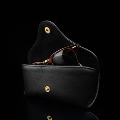 Your precious eyewear deserves the best so we designed a luxurious leather case for securely storing your glasses. The Deluxe has a classic and timeless design perfectly fit for men. Thanks to the sophisticated design, this case is fit for any occasion—from everyday wear to special occasions. The elegant and smooth velvet lining ensures that your glasses cannot be scratched while in the case, and it beautifully complements the supple leather exterior. As with all our products, we only use the fi Elegant Case As A Gift, Elegant Case With Case Included As Gift, Elegant Round Business Case, Elegant Leather Case, Classic Black Cases For Formal Occasion, Classic Black Case For Formal Occasions, Classic Leather Round Case, Classic Black Case With Leather Lining, Luxury Black Round Case