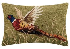 a decorative pillow with a bird on it