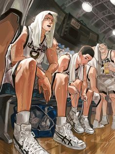 two basketball players are sitting on the bench with their shoes off and one is looking down