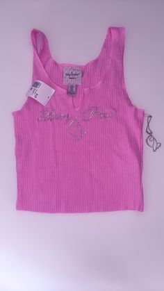 Baby phat x forever 21 pink tee. Embelished with diamontes this iconic top is a collabration between baby phat and forever 21.  The diamontes spell out 'Baby Phat' with the iconic cat mascot in between. The top is also accompanied with a silver keychain of the mascot which has also been embelished with diamontes.  Brand new with original tags, so whether it's for a special occasion or a treat for yourself this a perfect addition to your wardrobe! Baby Phat 2000s Outfit, Baby Phat 2000s, Cat Mascot, 2000s Outfits, Silver Keychain, Baby Phat, Y2k Clothing, Pink Tee, Clothing Brands