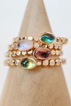 Delicate stacking ring perfect for wearing with all your other Pure Life rings. The ring band resembles small little disks all uniformly together. Choose from a variety of gemstones that adorn the ring and add the perfect pop of color. 6 x 4mm Oval Gem Band Measures 2.6mm Wide Spiritual Multicolor Multi-stone Rings, Fine Jewelry Multi-stone Crystal Ring, Bohemian Multicolor Multi-stone Rings, Collectible Multi-stone Blue Turquoise Ring, Collectible Blue Multi-stone Turquoise Ring, Delicate Stacking Rings, Pure Life, Twisted Metal, Tourmaline Ring