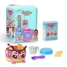 an assortment of toys including a cookie maker and cup