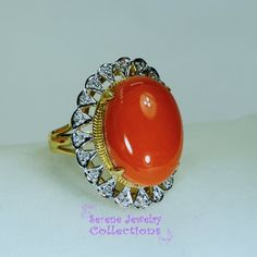 This pretty Levian red Coral Ring is set in 14k solid gold and is surrounded by a diamond halo!Ring Size: 7Total Weight: 9.25 gramsPrecious Metal: 14k solid goldPrecious stones:-Coral Center Stone: 19mm x 14mm, 10 carats-White Round diamonds: 0.2 ctHallmark: 14K, HK Red Diamond Ring With Halo, Heirloom Red Diamond Ring With 17 Jewels, Red Diamond Cluster Ring For Formal Occasions, Antique Red Diamond Ring For Anniversary, Collectible Oval Ruby Ring With Diamonds, Oval Ruby Ring With Diamond For Collectors, Red Round Cluster Ring For Formal Occasions, Exquisite Red Diamond Ring For Formal Occasions, Formal Red Ring Stamped 14k