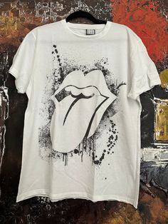 Vintage white The Rolling Stones men's T-shirt rare designed. We ship worldwide. Thank you for your shopping. White Crew Neck T-shirt Band Merch, Unisex White Graphic Design Top, Unisex White Graphic Tops, White Graphic Design Unisex Tops, Unisex White T-shirt With Graphic Print, White Urban T-shirt With Sublimation Print, White Crew Neck Band Merch T-shirt, White Fan Merchandise T-shirt For Summer, Summer White T-shirt For Fan Merchandise