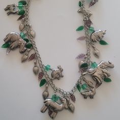 Preowned Condition Vintage Unique Silver Tone And Glass Charm Necklace Beautiful Silver Tone Charms Featuring Animals (Elephant, Camel, Rabbit, Leaves Etc) And Glass Charms In Different Colors Approximate Measurement In One Of The Pics Note: There May Be Patina Or Signs Of Wear On Preowned Condition 231014ses10zz-32 Bohemian Necklace, Animal Jewelry, Estate Jewelry, Vintage Silver, Womens Jewelry Necklace, Different Colors, Charm Necklace, Silver Tone, Vintage Jewelry