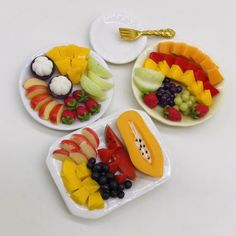 three plates with different types of fruit on them