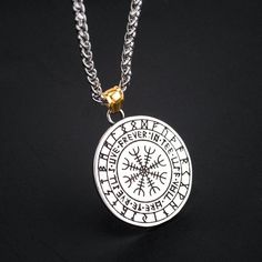 a necklace with an image of a compass on it