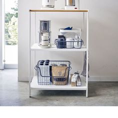 a white shelf with various items on it