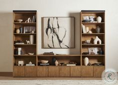 a living room filled with lots of wooden shelves and books on top of each other