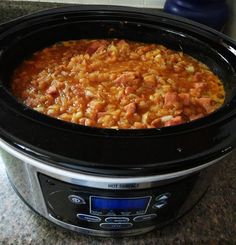 a crock pot filled with food sitting on top of a counter