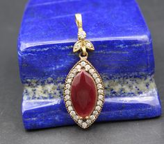 "I am offering you beautiful Turkish ottoman sterling silver & bronze drop pendant. Its %100 handcrafted workmanship with beautiful glass Ruby stone & Topaz beads with Unique workmanship. Please do not hesitate to contact if you have any questions. Weight : 7.6 grams, Length : Inches : 1.8\" ( 4.5cm ) Width : Inches 0.6\" ( 1.5cm ) Shipping & Estimated Delivery Time With Turkish Registered Post, Destination CountryStandard Shipping (business days) United States 15-20 Europe7-15 Asia1 Ottoman Jewelry, Turkish Ottoman, Carnelian Stone, Lapis Lazuli Stone, Bronze Pendant, Gold Wash, Ruby Stone, Heart Shape Pendant, Stone Heart