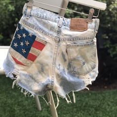 One Of A Kind, Upcycled Vintage Levi’s 560 Denim Shorts By The Laundry Room In California. American Flag Detailing Perfect For 4th Of July. Distressed By Design With Light Wash Bleach Patterns And Holes And Fraying. High Waisted, 5 Pocket Style. Listed As Small And Even Though The Waist Is 28, I’d Say It Fits Like A 27 Maybe Even A 26 With No Stretch (Waist 14” Hips 16.5”, Rise 10”) Really Hugs In The Right Places Like A Great Classic Pair Of Levis Does! Vintage Levi Vintage Levi's Summer Shorts, Levi’s Denim Shorts, Americana Jean Shorts With American Flag Print, Levi's High-waisted Cotton Shorts, American Flag Shorts, Levi's Bottoms With Built-in Shorts, Levi Shorts, Vintage Levis, Upcycled Vintage