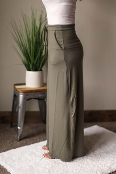 Long Elastic Waist Maxi Skirt in Light Olive • S-XL These long maxi skirts are so soft and comfortable! Maxi skirts are such an easy piece to create a fun, summer outfit! This maxi skirt features side pockets and an elastic waistband. The Fit of This Boutique Top: Pictured of a typical Small wearing the Small. See HOW TO MEASURE Here. Flat Across Measurements in Inches Size: Waist Across Hips Across Length Small 13.5 20 40 Medium 14 21 40.75 Large 15 22 41 X-Large 16 23 41 2XL Classy Closet Bout Cheap Non-stretch Solid Maxi Skirt, Affordable Fitted Green Maxi Skirt, Cheap Relaxed Fit Maxi Skirt, Cheap Solid Non-stretch Maxi Skirt, Modest Shirts, Modest Shirt, Long Green Skirt, Maxi Skirt With Pockets, Modest Boutique