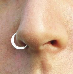 The moon tragus jewelry ,delicate ring made from Sterling Silver - larp jewelry ~ Can be used as a nose ring / septum / tragus / single earring / helix / lip ring ~ Size of the nose ring: Inner diameter : 1/4, 5/16 or 3/8 inch (7,8 or 9 mm) Wire gauge : 24,22,20,18 or 16 (0.5, 0.6, 0.8, 1 or 1.2 mm) ~ For larger sizes and special requests please contact me through the' Request custom order' bar. ~To open the ring -gently twist the ends sideways, slip into the hole and then gently twist the ends Bohemian Hypoallergenic Nose Rings As Gift, Minimalist Internally Threaded Septum Ring, Minimalist Hypoallergenic Nose Ring, Dainty Internally Threaded Small Hoop Nose Rings, Minimalist Adjustable Tiny Nose Rings, Dainty Silver Pierced Nose Rings, Dainty Silver Nose Rings, Minimalist Nickel-free Silver Septum Ring, Minimalist Nickel Free Nose Ring