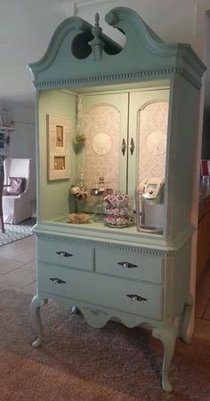 an old china cabinet has been transformed into a coffee bar