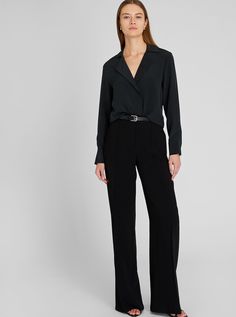 A button-down shirt takes inspiration from classic tailoring with notched lapels, a layered placket, and an inverted back pleat. A silk fabrication softens the look. Classic Tailoring, Open Neck, Pant Suit, Club Monaco, Silk Top, Neck Shirt, Black Blouse, Monaco, Womens Clothing Tops