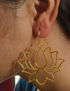 Brass Lotus Flower Dangle Earrings, Lotus Flower Earrings,Yoga Jewelry,14K Flower Drop Earrings,Spiritual Jewelry,Mothers Day Gifts Gemstone -  Na Jewelery Category:- Hoop,Earring Metal:-Brass -- T H E * Q U A L I T Y We buy raw gemstones directly from miners and then get them cut and polished at our workshop , Therefore saving some bucks (additional added fees and markups) avoiding a middle man and making sure of the authenticity of the gems. And we use top quality materials that are water safe (ideally) However it is highly recommended to avoid water since doing so will prolong the durability and quality of your jewelry. Also, we recommend avoiding contact with chemicals such as bleach, perfume and sunscreen because they can damage the material over time which will affect its quality. -- Gold Floral Jewelry For Festivals, Brass Flower-shaped Earrings For Gifts, Spiritual Earrings For Festivals Gift, Spiritual Style Earrings For Festivals Gift, Spiritual Earrings For Festivals And Gifts, Spiritual Festival Earrings Gift, Festival Flower Earrings For Pierced Ears, Festival Gift Flower Earrings For Pierced Ears, Gold Spiritual Drop Earrings