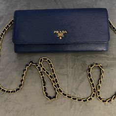 Slate Vitello Leather Prada Wallet On Chain Gold-Tone Hardware, Single Chain Link Shoulder Strap. 3 Compartment At Interior One With Zipper Compartment And 6 Cc Holders Dual Snap Closure In Front Beautiful 100% Authentic Comes With Tags And Dust Bag And Box .. Pristine Condition. Luxury Blue Wallet For Formal Occasions, Elegant Evening Blue Wallets, Elegant Blue Evening Wallets, Blue Clutch With Chain Strap For Formal Occasions, Blue Clutch With Chain Strap For Formal Events, Blue Formal Clutch With Chain Strap, Formal Blue Clutch With Chain Strap, Elegant Blue Wallets, Elegant Leather Wallet With Chain Detail