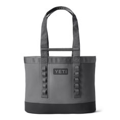 a grey and black tote bag with the word yet on it's side