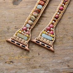 Bliss Boho Apple Watch Band Wrap Dress up your tech with this unique Boho Apple Watch band! Our wrap-around watchband is beautifully handcrafted using calming natural Rhodonite and Jasper stones loomed on natural brown cord. It comes with an adjustable closure to fit most wrist sizes. Refresh your smartwatch with these special beaded straps. Our boho watch strap is the perfect gift for yourself, the independent, or the free-spirited. And of course, get the benefits of the natural stones while we Boho Watch, Apple Watch Bracelets, Bracelet Apple Watch, Wristband Bracelet, Healing Crystal Jewelry, Apple Watch Faces, Jasper Beads, Apple Watch Strap, Apple Watch Band