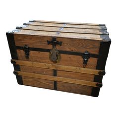 an old fashioned wooden trunk with metal handles