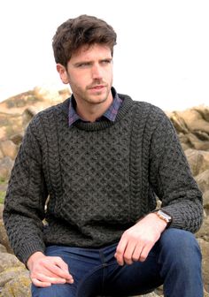 This, the most famous style in Aran Knitting,it can be worn by both men and women. It incorporates a variety of Irish Aran Stitches that were believed to bring luck, success, and health to the wearer. Honeycomb indicating the hard working honey bee, and Aran basket stitch to bring the omen of good luck, and the diamond to bring wealth. Warmth is the key to this style and made with 100% wool it is sure not to let you down. The Aran Sweater is a timeless wardrobe essential and a sweater for life. Aran Stitches, Irish Fisherman Sweater, Basket Stitch, Irish Fisherman, Aran Jumper, Men Knitwear, Aran Knitting, The Omen, Mens Sweaters