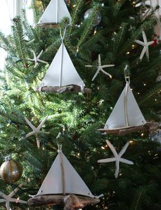 a christmas tree with ornaments hanging from it's branches and the caption, visit