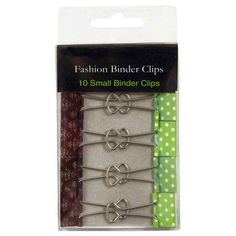 four pairs of binder clips in green and white polka dot paper with bows on them