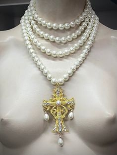 Four strands white pearl necklace with Baroque style cross. The cross has pearl cabochon centre. Make a statement wearing this unique piece. 4 strands of 12mm glass pearls. The fourth strand has its own livestream claw clasp, so that you can wear the cross on its own! Materials used are: 12mm crystal glass pearls or regular glass pearls with perlized coating. Cross is zinc alloy with glass rhinestones.  Ask me any questions prior to order i am happy to reply. Exquisite Luxury Baroque Jewelry, Luxury Baroque Necklace With High Luster, Statement Cross Necklace, Multi Layer Pearl Necklace, White Pearl Necklace With Cross Pendant, White Cross Pearl Drop Necklace, White Cross-shaped Pearl Drop Necklace, White Pearl Drop Cross Necklace, Elegant White Cross Necklace With Pearl Chain