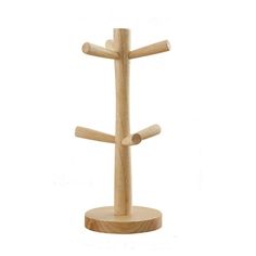 a wooden stand with three crosses on it's sides and two holes in the middle