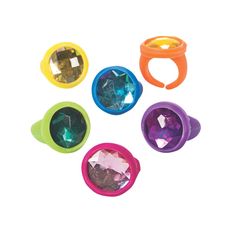 four different colored plastic rings on a white background