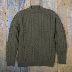 Knit of soft 100% alpaca, this pullover sweater from Peru brings the elegance of the Andes wherever it goes. Wilber Calapuja designs and crafts the sweater, which features a solid color in sage with diamond, rope, and wave patterns. Alpaca Sweater, Wave Pattern, Sweater Accessories, Alpaca, Pullover Sweaters, Men Sweater, The 100, Solid Color, Textiles