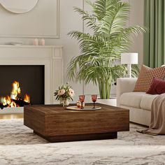 a living room filled with furniture and a fire place in front of a couches