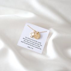 Take a look at our stunning necklace with an adjustable stainless steel chain. It features a delicate cross charm adorned with beautiful mother-of-pearl. Additionally, there's a small disc you can customize. Choose to engrave a name, just the reference of a Bible verse like "John 3:16" (not the entire verse), a meaningful date, or the Christian fish symbol. It's a unique way to proudly display your faith. D E T A I L S ✧ High-quality Stainless Steel   ✧ Adjustable necklace size 18" - 19" | (45 c Spiritual Crucifix Necklace For Gift, Spiritual Crucifix Necklace As Gift, Spiritual Cross Pendant Necklaces For Gift, Spiritual Cross Pendant Necklace For Gift, Inspirational Jewelry With Adjustable Chain Gift, Inspirational Jewelry With Adjustable Chain As A Gift, Adjustable Crucifix Necklace For Gift, Personalized Cross Pendant Jewelry Gift, Personalized Cross Pendant Jewelry For Gifts