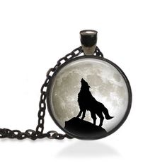 This listing is for a handmade art pendant, featuring: A Wolf Howling at the full Silver Moon.  When you purchase this listing, you will receive one pendant with matching chain. Pendant size is 1 inch , chain length is 24 inches long with a lobster clasp.  Chains can be shortened or made longer (addition fee apply) at your request. Pendants are not 100% waterproof so showering, bathing, or swimming with your beautiful new pendant is not advised. Please review my policy page for the latest shop i Wolf And Moon Jewellery, Wolf Necklace Men, Silver Necklace With Wolf Design Round Pendant, Men Wolf Necklace, Nebula Necklace, Full Moon Necklace, Wolf Pendant Necklace, Galaxy Jewelry, Planet Necklace