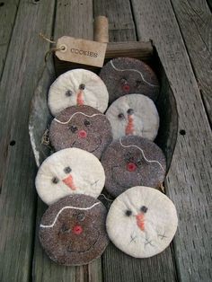 a bunch of buttons sitting on top of a wooden table