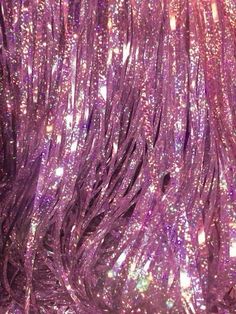 purple glitter fabric with lots of sparkle on it