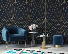 two chairs and a table in front of a black wall with gold lines on it