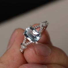 This is a gorgeous handmade creation. Its beauty is its simplicity & Elegance. The 6*8mm cushion cut natural aquamarine is crafted in sterling silver with rhodium plated. It's made to order and it will take about 7-10 days to make it. All item is sent in a beautiful gift box You can realize more lovely stuff clicking the link https://www.etsy.com/shop/knightjewelry?refshopsection_shophome_leftnav Please leave the correct address and you phone number for delivering successfully. Aquamarine Engagement Ring Sterling Silver, Cushion Cut Blue Topaz Promise Ring, Aquamarine Gemstone Ring In Radiant Cut, Blue Topaz Cushion Cut Promise Ring, Aquamarine Gemstone Ring With Radiant Cut, Silver Aquamarine Jewelry With Asscher Cut, White Gold Blue Topaz Cushion Cut Ring, Radiant Cut Aquamarine Gemstone Ring, White Gold Rings With Aquamarine Gemstone Accents