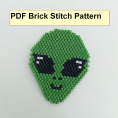 an alien head made out of legos on a white background with the words brick stitch pattern