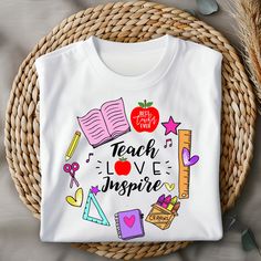 a white t - shirt with the words teach love inspire surrounded by school supplies