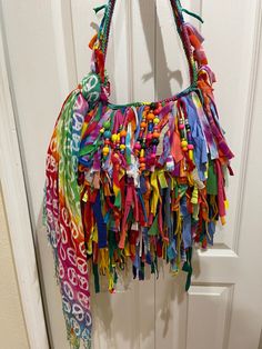 "hippie fringe bag,tye dye handbag,Fringed handbag,Custom fringe Bag,fabric fringe bag,statement handbag,fringe shoulder bag BEFORE I start with my description i wanted to let you know I CAN WORK WITH ANY BUDGET. I can build a handbag to FIT ANY BUDGET. Just drop me a line and tell me what you want and i'll let you know what type/size/shape/design handbag i can produce for that amount. THIS HANDBAG HAS BEEN SOLD...BUT... I can custom make one for you. This item is custom made and ONE OF A KIND. Multicolor Fringe Bags For Festival, Festival Fringe Hobo Shoulder Bag, Multicolor Festival Bags With Fringe, Festival Multicolor Fringe Bags, Festival Fringe Hobo Tote Bag, Statement Handbag, Fringe Handbags, Everyday Handbag, Tiny Puppies