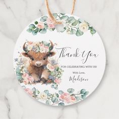 a thank card with an image of a cow on it and flowers around the edges