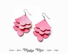 pink leather earrings with scalloped shapes on them, sitting on a white background